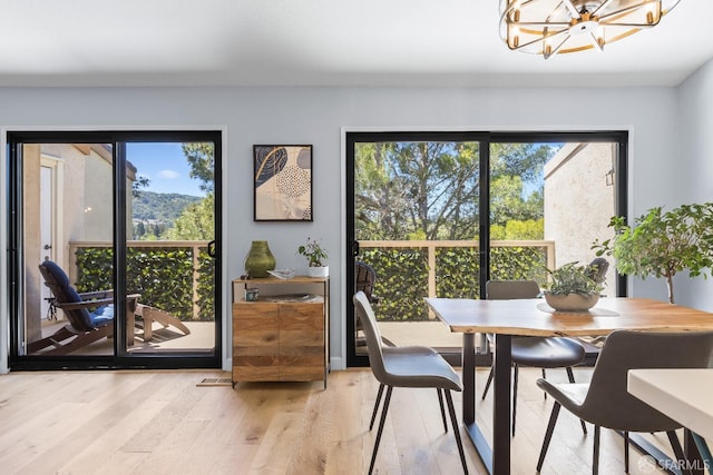 1541 Moraga Way, Moraga, CA 94556 - dining area featuring a chandelier, light wood-type flooring, and plenty of natural light