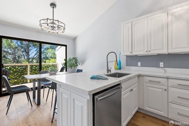 1541 Moraga Way, Moraga, CA 94556 - kitchen featuring a sink, dishwasher, a peninsula, a chandelier, and white cabinetry