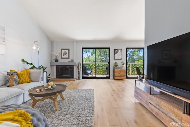 1541 Moraga Way, Moraga, CA 94556 - living room with light wood-style flooring and a fireplace with raised hearth