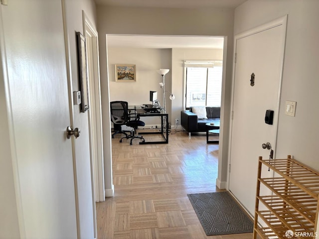 hallway featuring baseboards