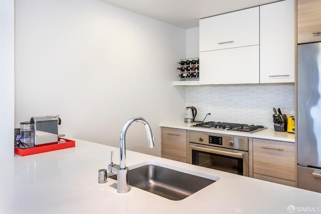 451 Donahue St Unit 207, San Francisco, CA 94124 - kitchen with stainless steel appliances, modern cabinets, a sink, and light countertops