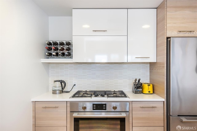 451 Donahue St Unit 207, San Francisco, CA 94124 - kitchen with appliances with stainless steel finishes, modern cabinets, backsplash, and light countertops
