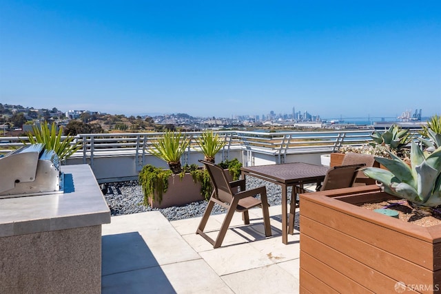 451 Donahue St Unit 207, San Francisco, CA 94124 - view of patio featuring area for grilling, outdoor dining space, and a city view