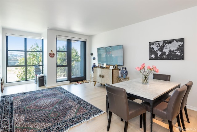 451 Donahue St Unit 207, San Francisco, CA 94124 - dining space with light wood finished floors