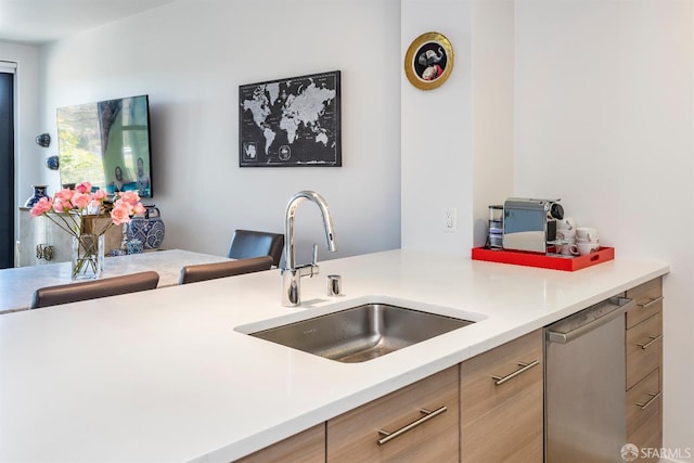 451 Donahue St Unit 207, San Francisco, CA 94124 - kitchen with a sink, stainless steel dishwasher, light countertops, and modern cabinets