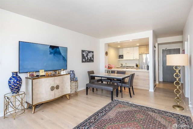 451 Donahue St Unit 207, San Francisco, CA 94124 - dining room with light wood-style flooring, baseboards, and recessed lighting
