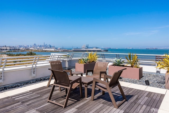 451 Donahue St Unit 207, San Francisco, CA 94124 - wooden deck with outdoor dining area and a water view