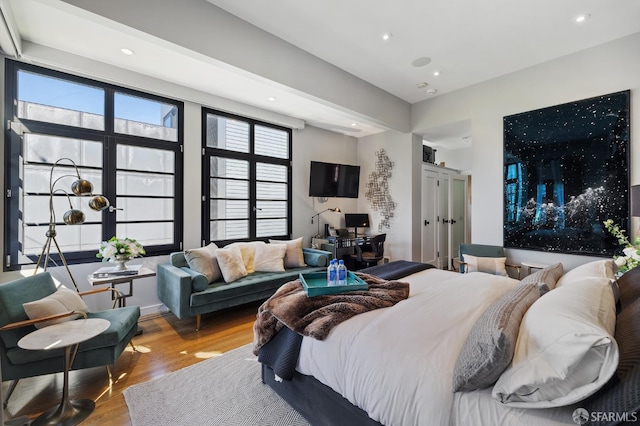 bedroom with wood-type flooring