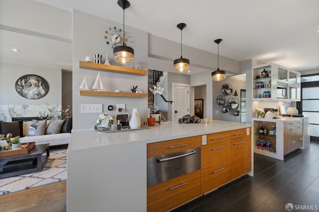 kitchen featuring pendant lighting, dark hardwood / wood-style floors, and a kitchen island