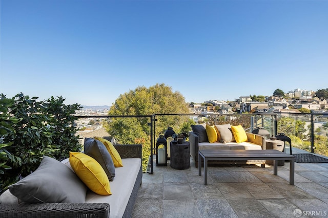 view of patio / terrace with a balcony and an outdoor living space