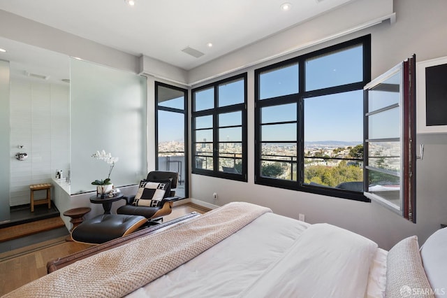 bedroom with wood-type flooring