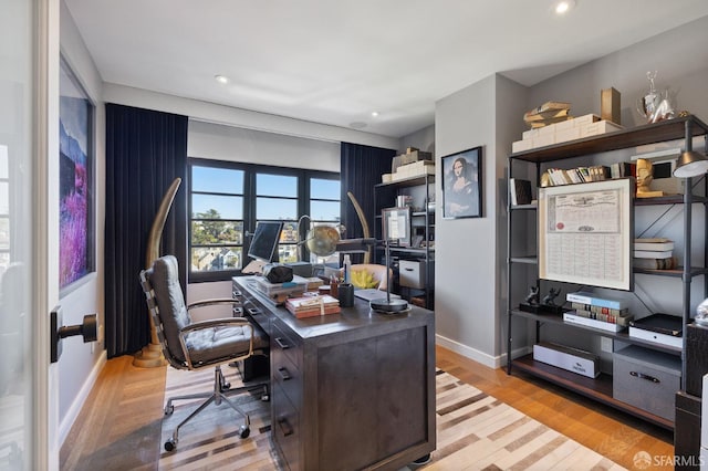 office area with light hardwood / wood-style flooring