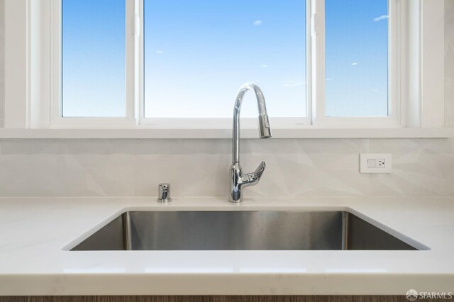 269 E Ave, San Bruno, CA 94066 - kitchen view of white cabinets, tasteful backsplash, and light countertops
