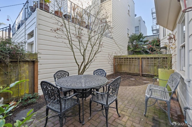 view of patio / terrace with a fenced backyard and outdoor dining space