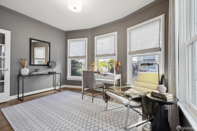 office space featuring ornamental molding, dark wood-style flooring, and baseboards