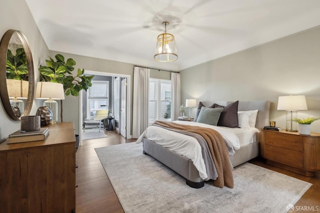 bedroom featuring dark wood finished floors