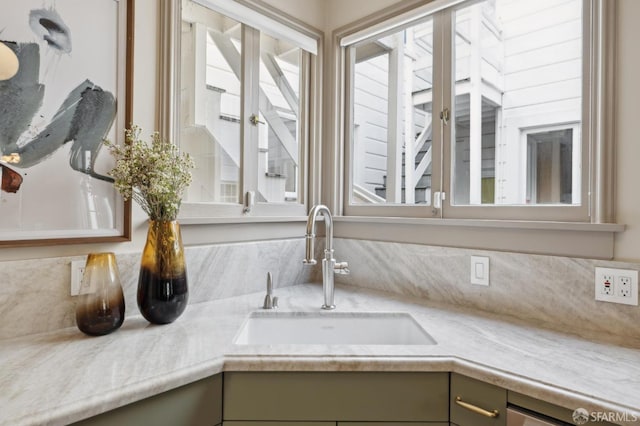 details featuring light countertops and a sink