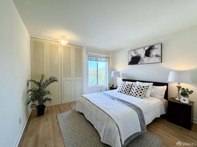 bedroom with light wood-type flooring