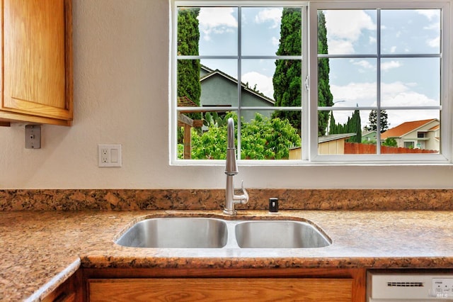 1001 Suffolk Way, Fairfield, CA 94533 - kitchen view of dishwasher, a textured wall, and light stone counters
