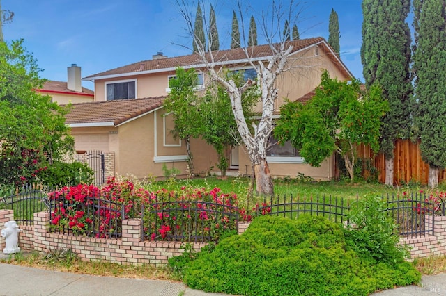 1001 Suffolk Way, Fairfield, CA 94533 - view of front of home with stucco siding, a tiled roof, and an attached garage