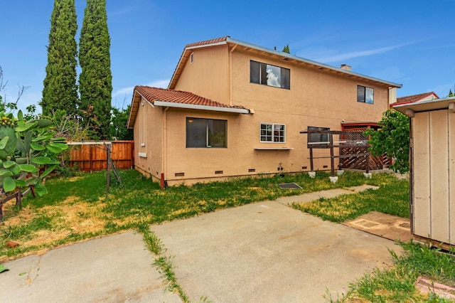 1001 Suffolk Way, Fairfield, CA 94533 - back of property featuring crawl space, a patio area, a tile roof, and stucco siding