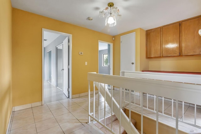 1001 Suffolk Way, Fairfield, CA 94533 - corridor with a chandelier, light tile patterned floors, and an upstairs landing