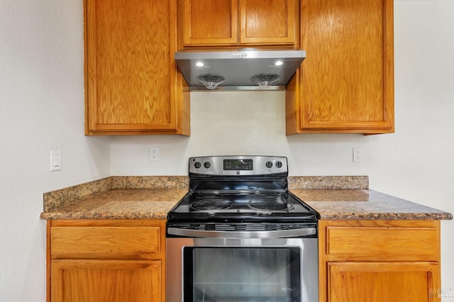 1001 Suffolk Way, Fairfield, CA 94533 - kitchen with electric stove, extractor fan, and stone counters