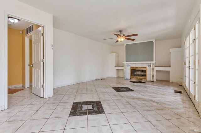 1001 Suffolk Way, Fairfield, CA 94533 - unfurnished living room with ceiling fan, light tile patterned flooring, a tiled fireplace, and french doors