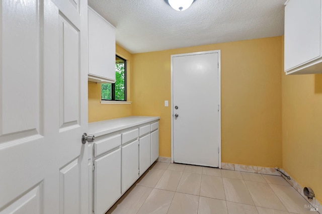 1001 Suffolk Way, Fairfield, CA 94533 - laundry room with a textured ceiling and light tile patterned flooring