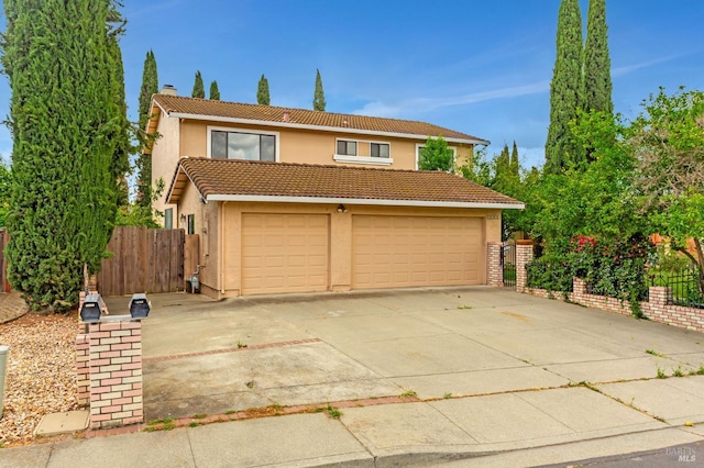 1001 Suffolk Way, Fairfield, CA 94533 - traditional home featuring stucco siding, a tiled roof, a garage, driveway, and a chimney