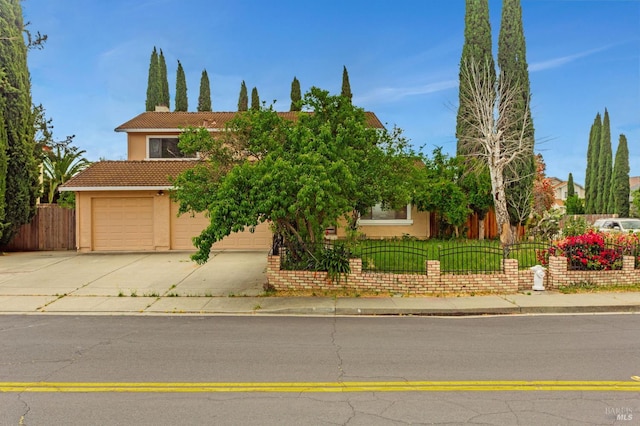 1001 Suffolk Way, Fairfield, CA 94533 - obstructed view of property with stucco siding, a tile roof, concrete driveway, and an attached garage