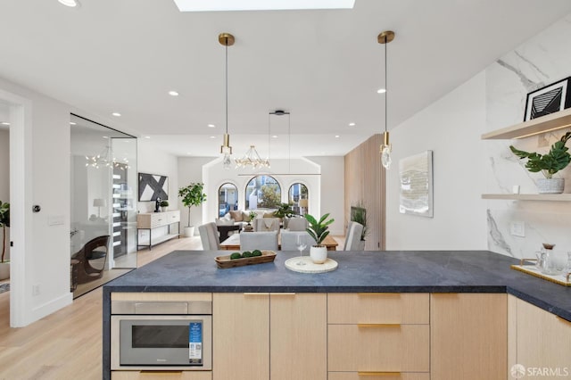 2287 45th Ave, San Francisco, CA 94116 - kitchen with light brown cabinets, light wood finished floors, open floor plan, dark countertops, and recessed lighting
