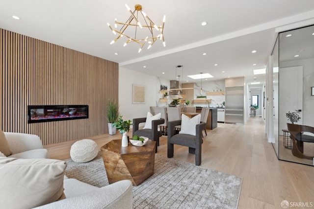 2287 45th Ave, San Francisco, CA 94116 - living area with light wood-style floors, recessed lighting, a glass covered fireplace, and a chandelier
