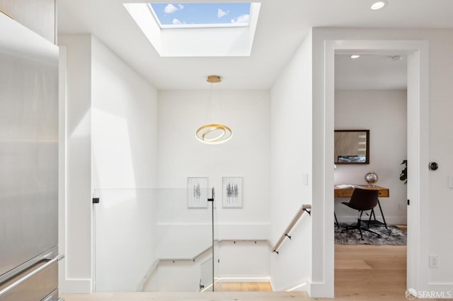2287 45th Ave, San Francisco, CA 94116 - staircase featuring wood finished floors, a skylight, and recessed lighting