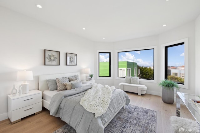 2287 45th Ave, San Francisco, CA 94116 - bedroom featuring multiple windows, light wood-style floors, recessed lighting, and baseboards