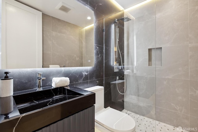 2287 45th Ave, San Francisco, CA 94116 - full bath with walk in shower, toilet, vanity, tile walls, and backsplash