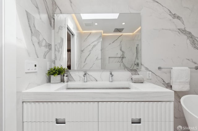 2287 45th Ave, San Francisco, CA 94116 - full bathroom with vanity, a soaking tub, a marble finish shower, tile walls, and a skylight