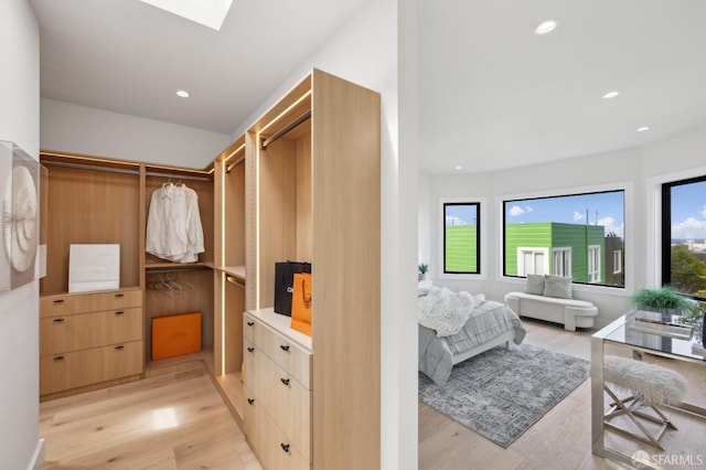 2287 45th Ave, San Francisco, CA 94116 - bedroom with light wood-type flooring, a skylight, and recessed lighting