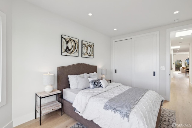 2287 45th Ave, San Francisco, CA 94116 - bedroom with light wood-style flooring, recessed lighting, and a closet