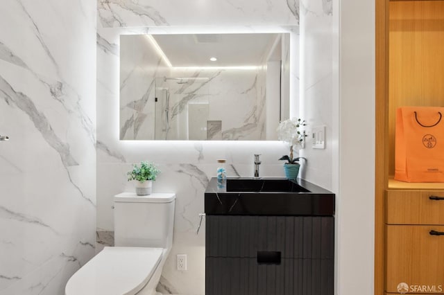 2287 45th Ave, San Francisco, CA 94116 - full bath featuring vanity, toilet, a marble finish shower, and tile walls