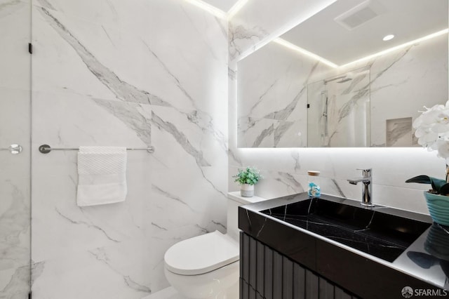 2287 45th Ave, San Francisco, CA 94116 - full bath featuring a marble finish shower, toilet, vanity, and tile walls