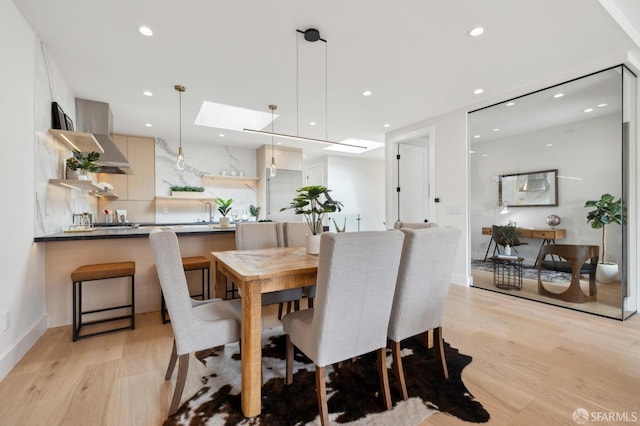 2287 45th Ave, San Francisco, CA 94116 - dining space featuring light wood-type flooring, recessed lighting, and a skylight