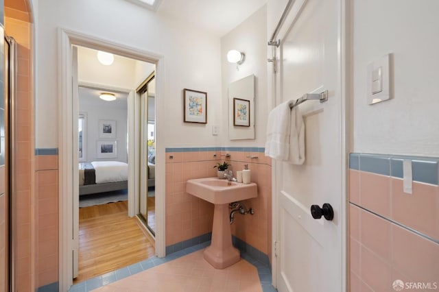 bathroom featuring tile walls and tile patterned floors