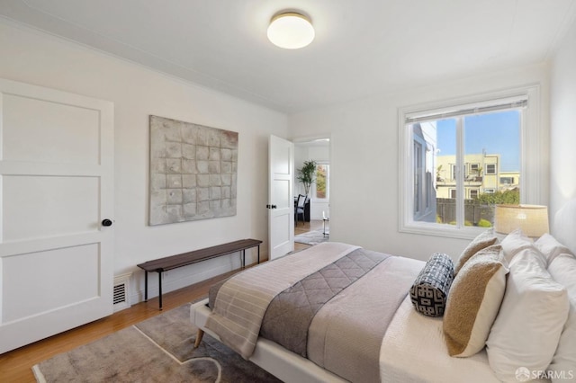 bedroom featuring hardwood / wood-style flooring