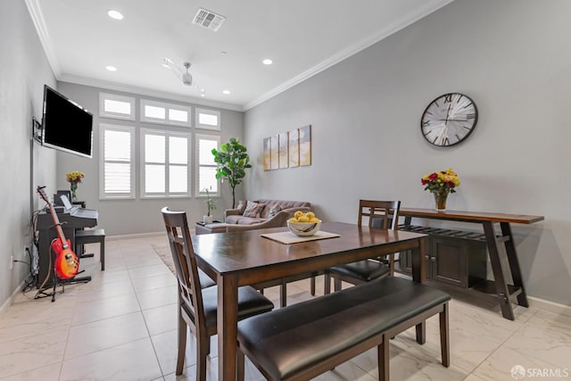 dining room featuring ornamental molding