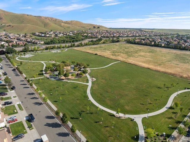 birds eye view of property featuring a mountain view