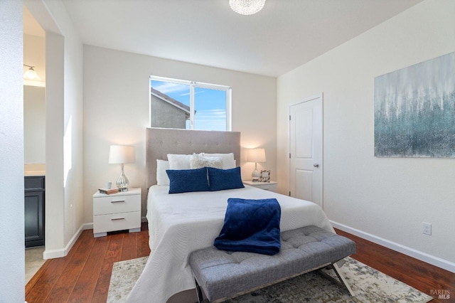 bedroom featuring baseboards and wood finished floors