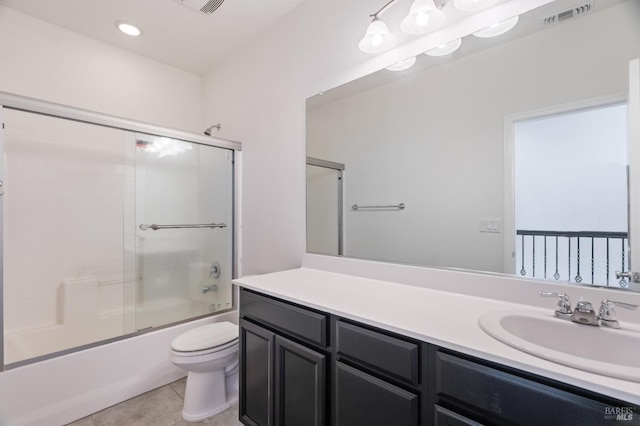 bathroom with vanity, toilet, tile patterned floors, enclosed tub / shower combo, and visible vents