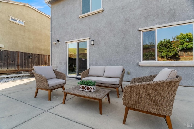 view of patio featuring fence and outdoor lounge area
