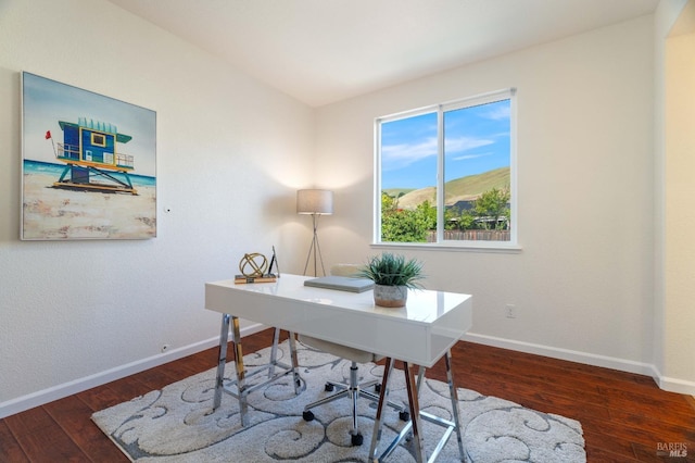 office area featuring wood-type flooring and baseboards